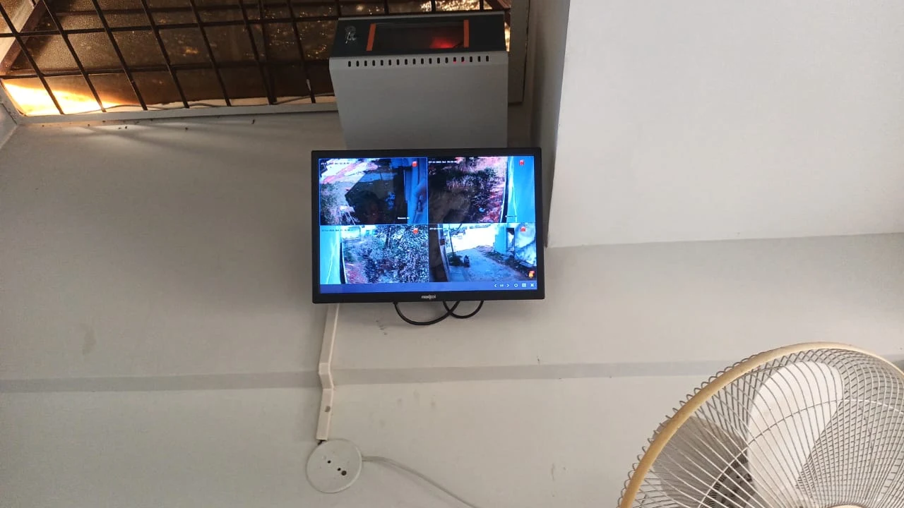 CCTV monitor displaying several camera views inside a building
