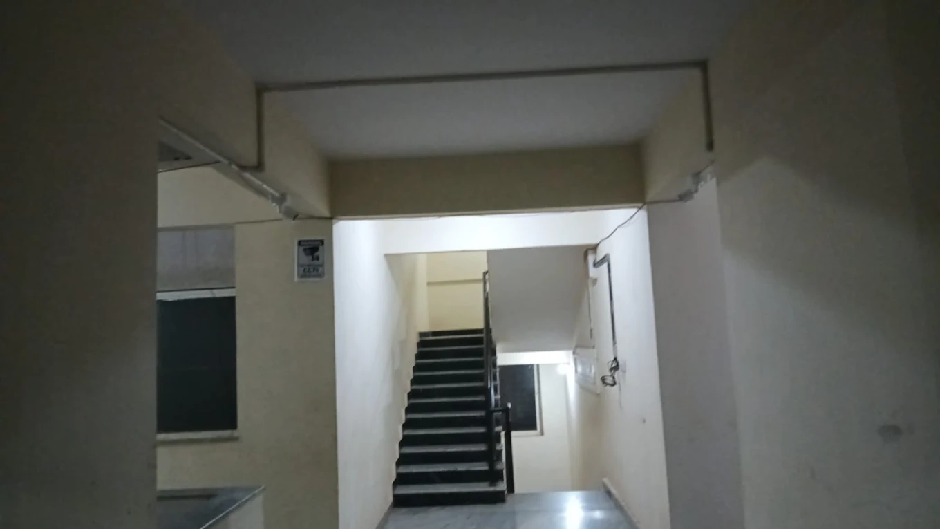 CCTV cable route beside an interior stairwell